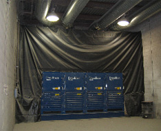 Four Torit Downflo WorkStation modules used to clean the blasting room's air. 