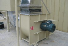 Square fan configuration with a backwardly inclined wheel exhausting a dust collector.