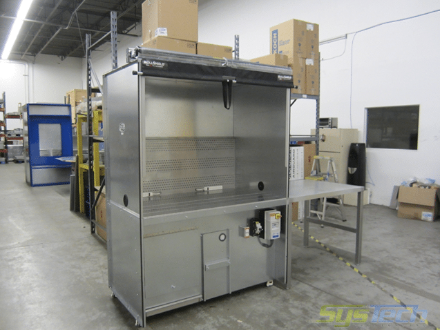 Downdraft booth Dual Draw Model TB3560 –IN used to contain ink splatter and ink vapors. Unit is sized for 2000 CFM and has throwaway filters MERV 7 and a carbon filter bank. Booth has internal light system, retractable shade, access door and detachable side panel. 