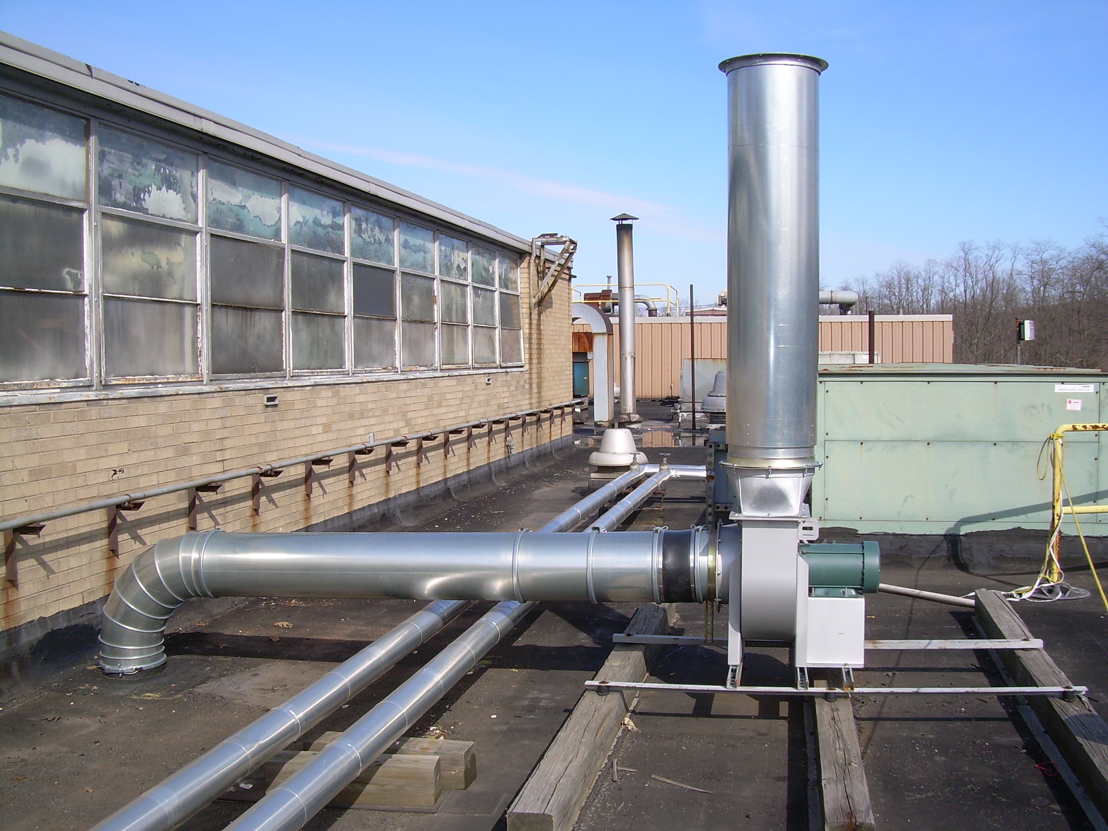 Fume System Ductwork - Using “clamp together” duct and fittings on a roof-mounted fan minimized installation time and allowed for future movement of the system if necessary.