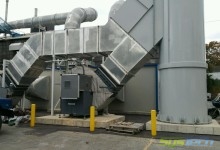 Electrical motor noise enclosure and fan housing noise wrap-applied to two (2) air pollution control system centrifugal fans.