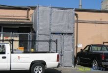 An outdoor dust collector installation utilizing a blower running at 95 dBA with required attenuation to 70 dBA. To accomplish this, the blower was outfitted with a fan discharge silencer and the entire dust collector enclosure was blanketed with outdoor quilted sound absorbing blankets.