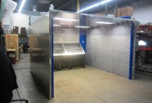 DualDraw Wet Scrubber Walk-In Booth applied to aluminum debur process - 12' x 12'x 8' in size, 15 HP Motor, interior sound curtains, 8,000 CFM with 2,000 CFM regain airflow. Collector is made of 304 SS with booth constructed of aluminum. Equipment complies with NFPA 484 (2015) guidelines for wet collection of combustible dust.